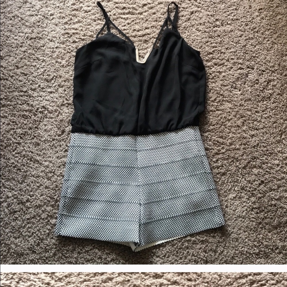A Lulumari black open back Romper - Picture 1 of 8